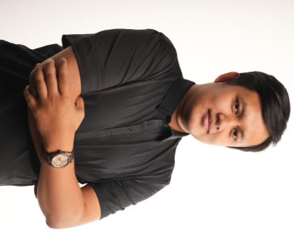 Dika, Febriyandika Tarang Boro, wearing a black shirt with arms folded